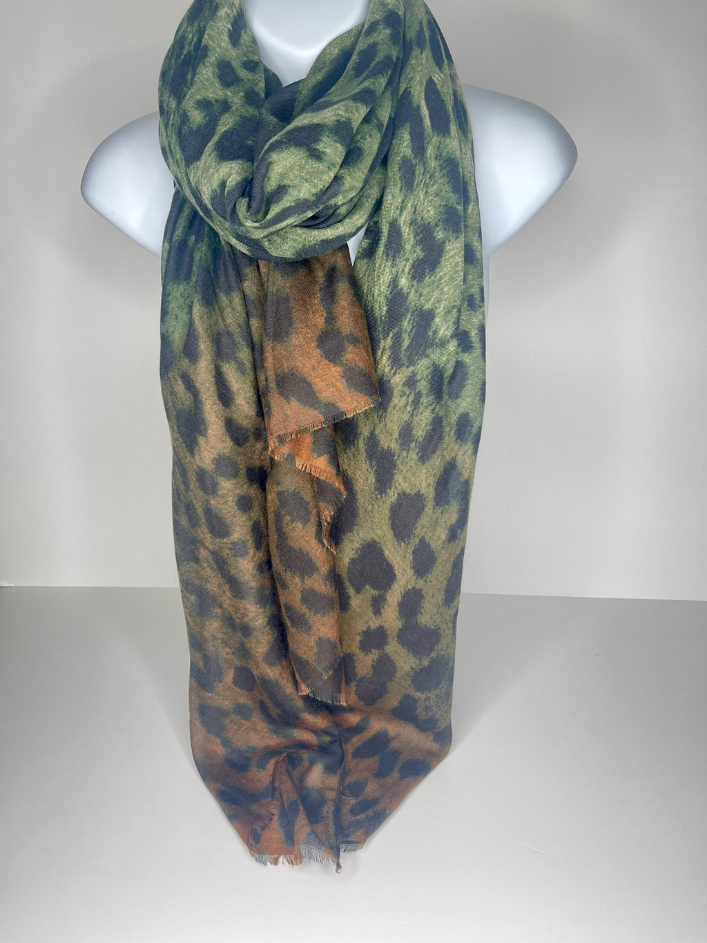 Lighter weight cheetah print scarf in shades of brown, black and green