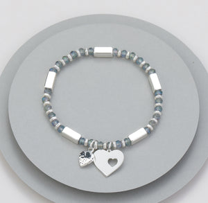 Elasticated bracelet with silver stations, natural beading and two-heart motif