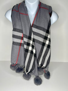 Winter weight, cashmere-blend, tartan print scarf in shades of grey, white, black and red, with faux poms