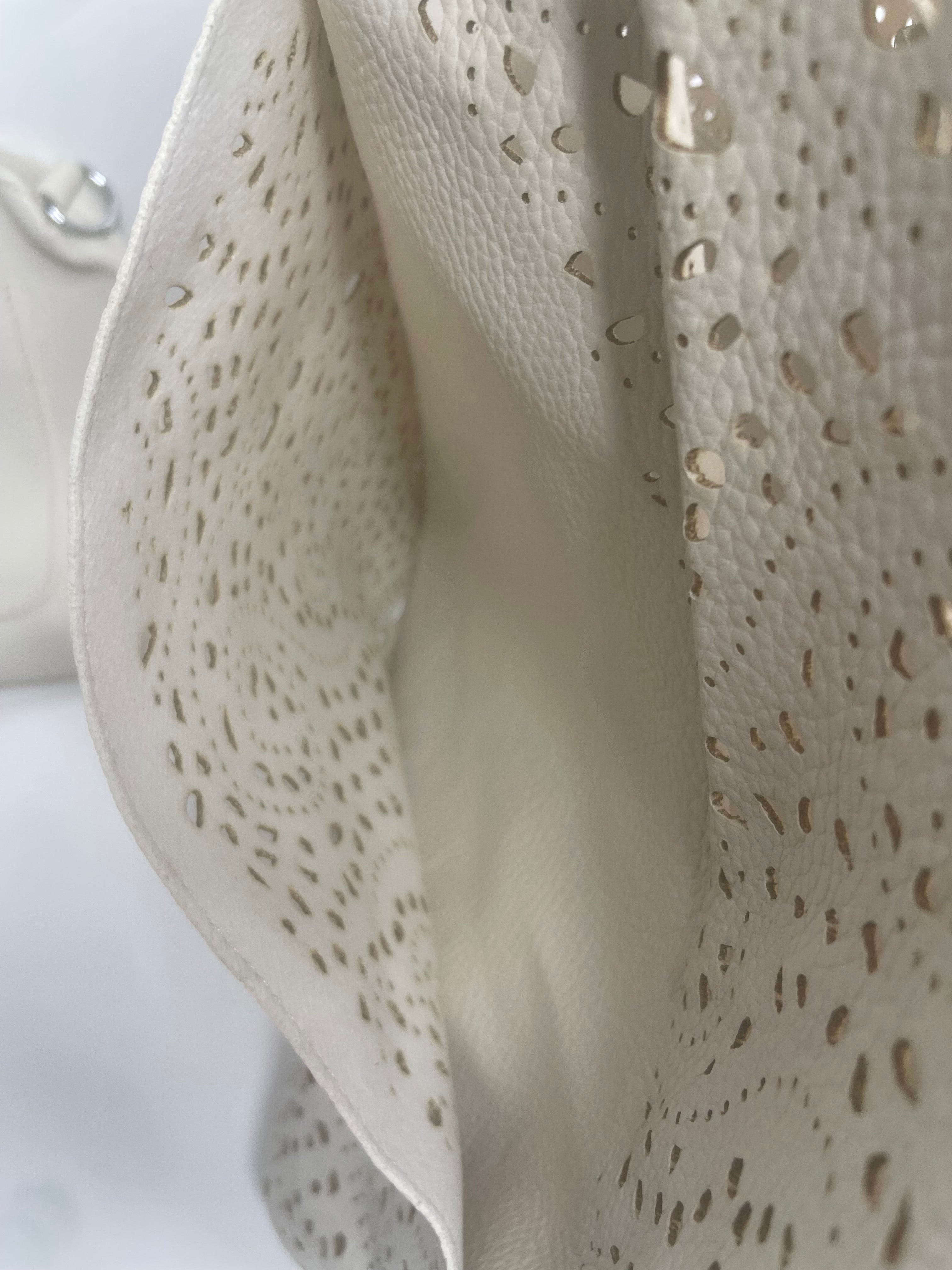 Turquoise laser cut shoulder bag - made from recycled water bottles - just like leather!