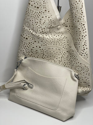 Turquoise laser cut shoulder bag - made from recycled water bottles - just like leather!