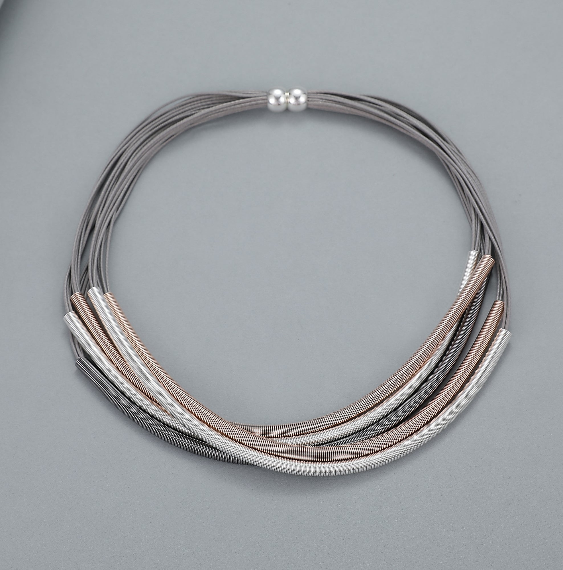 Short magnetic necklace with rose gold, silver and pewter flexible coiled wire