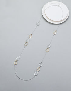 Long necklace, with interlinked silver and gold open-oval stations - on a silver chain