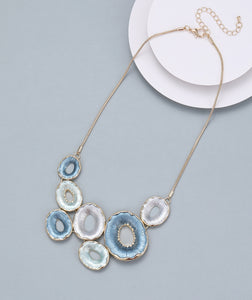 Short necklace, with denim blue, light sage green and grey open-circle stations - on a gold chain