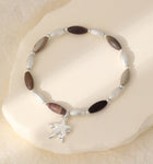 Elasticated bracelet in silver & earthy tones, with star pendant