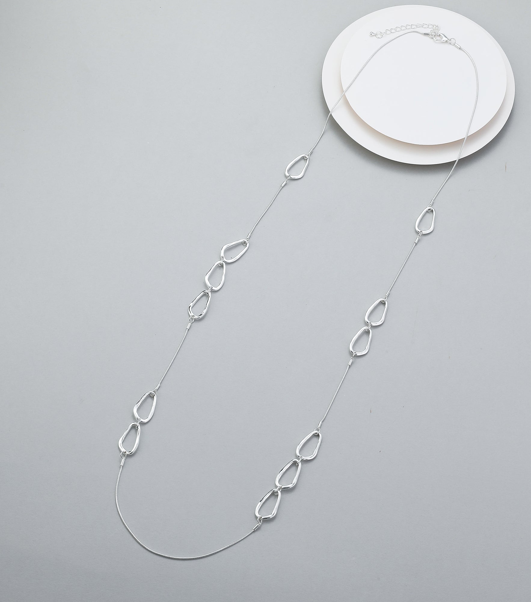 Long necklace, with interlinked silver open-oval stations - on a silver chain
