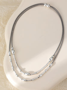 Short magnetic necklace, with silver two-row beaded stations