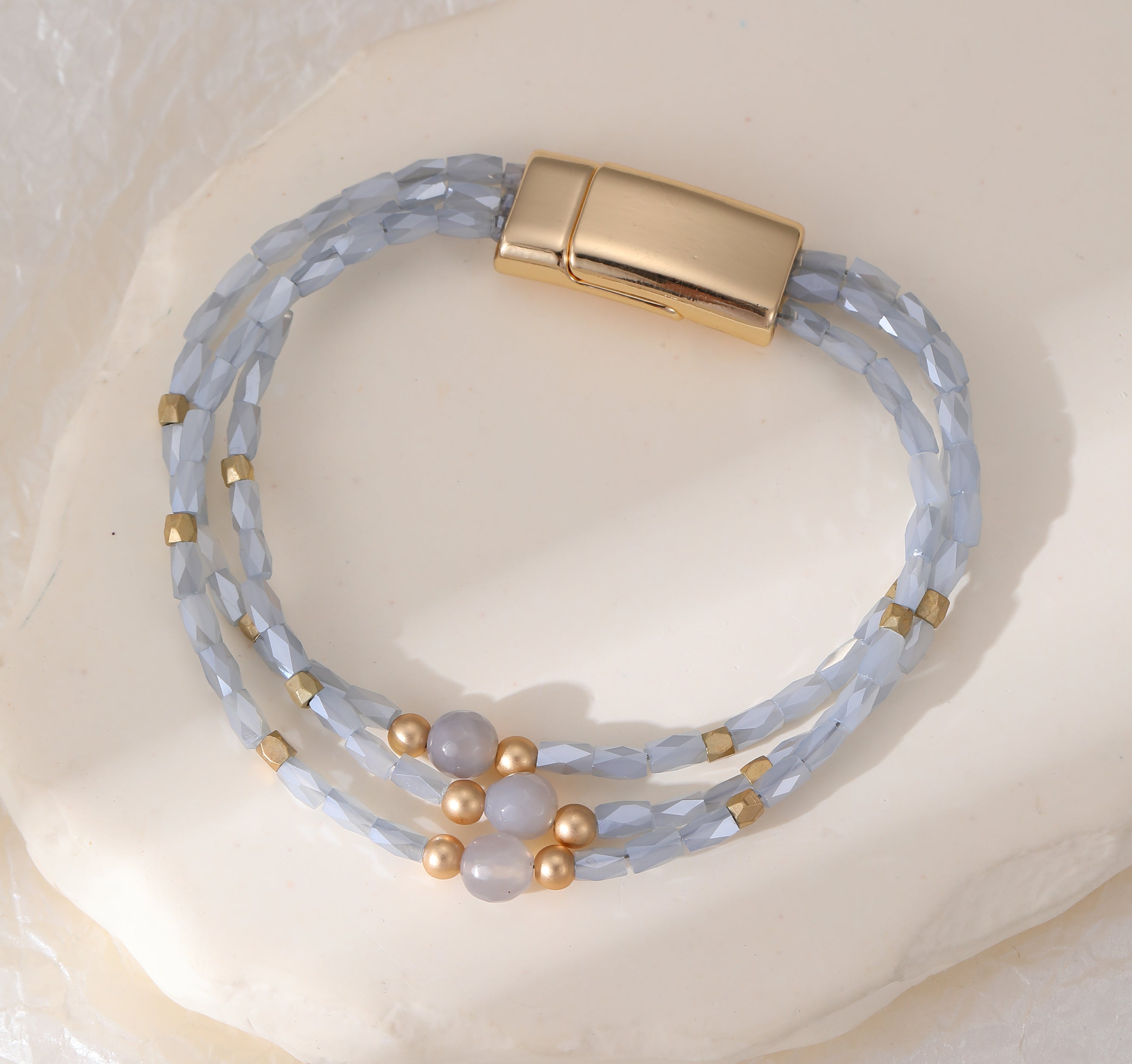 Magnetic bracelet with tri-row baby blue crystal beads
