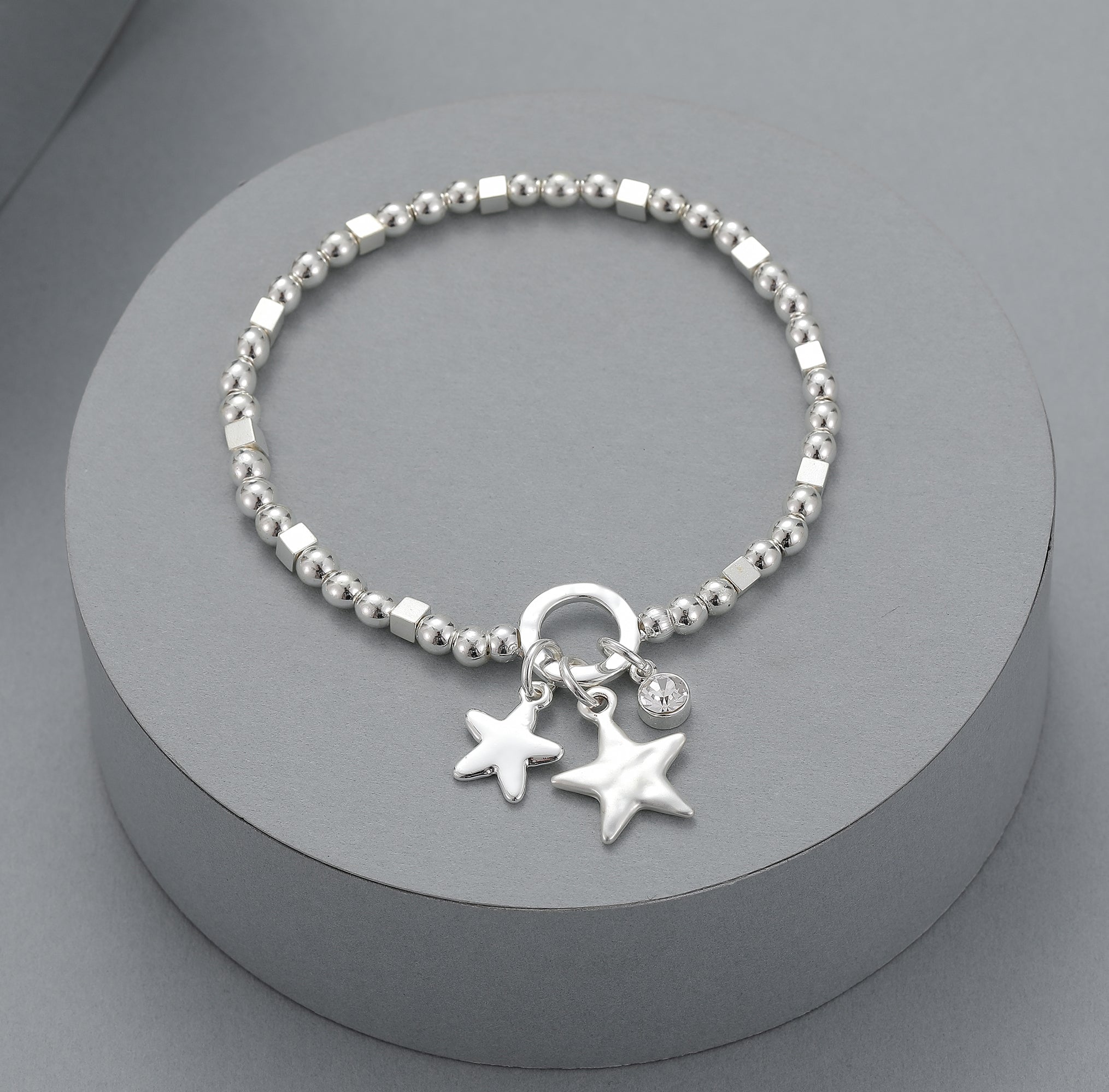 Elasticated bracelet with silver beads, double star and crystal detail