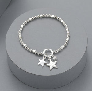 Elasticated bracelet with silver beads, double star and crystal detail
