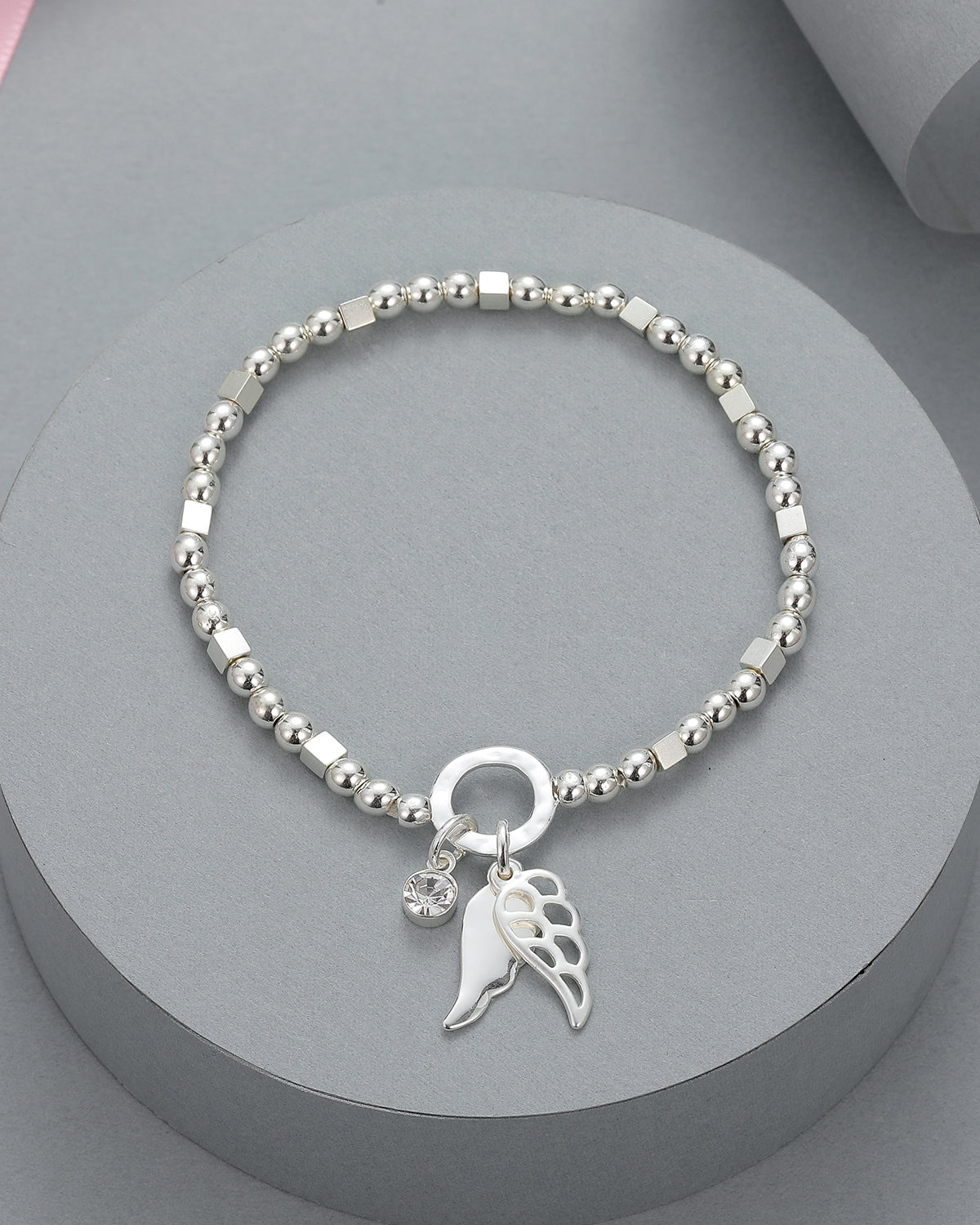 Silver elasticated bracelet with angel wing motif