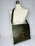 Vegan leather, cross-body satchel bag with top zip, magnetic dot closure and adjustable strap in olive green