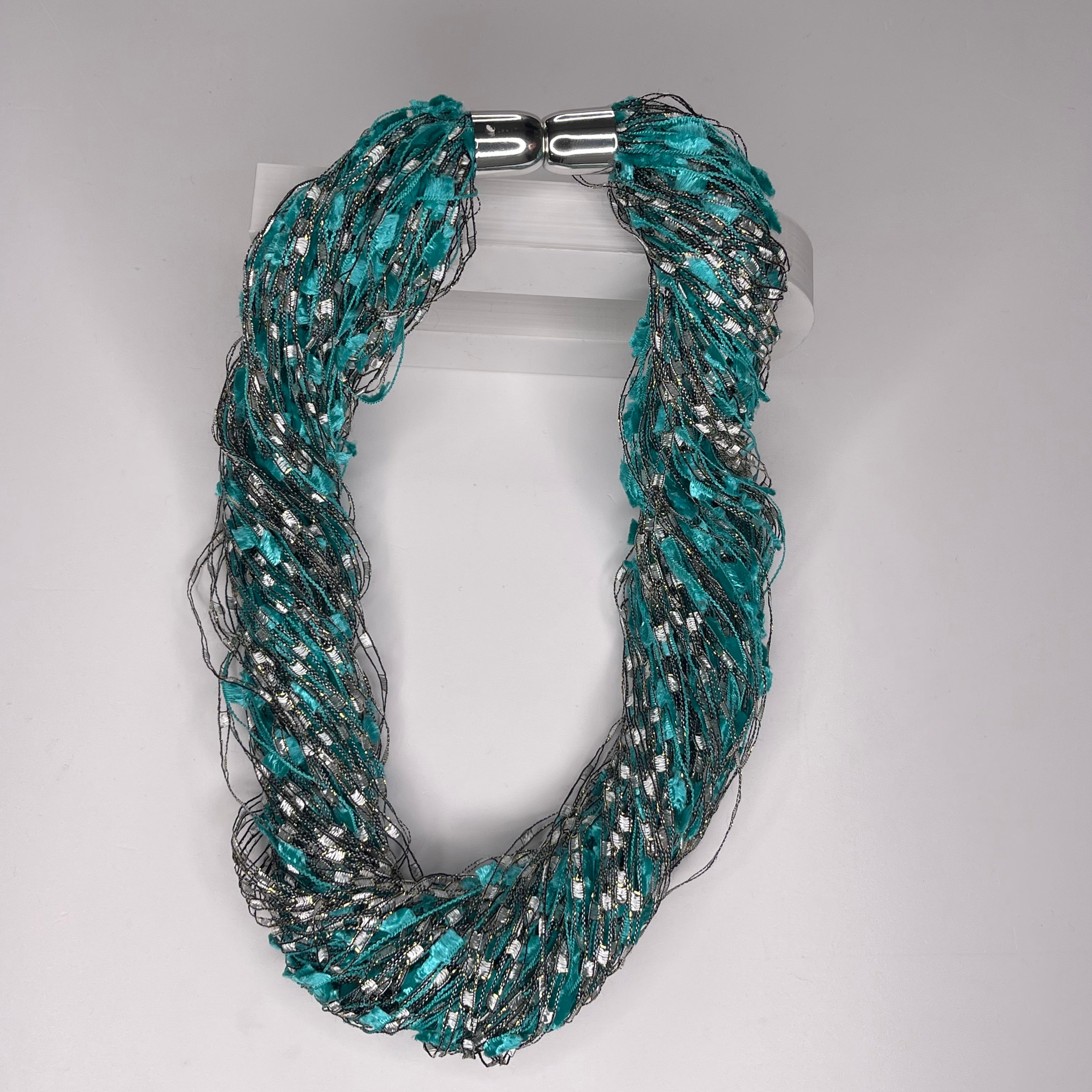 Magnetic twist scarf necklace, in colours of aqua, silver and grey