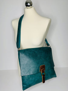 Vegan leather, cross-body satchel bag with top zip, magnetic dot closure and adjustable strap in teal