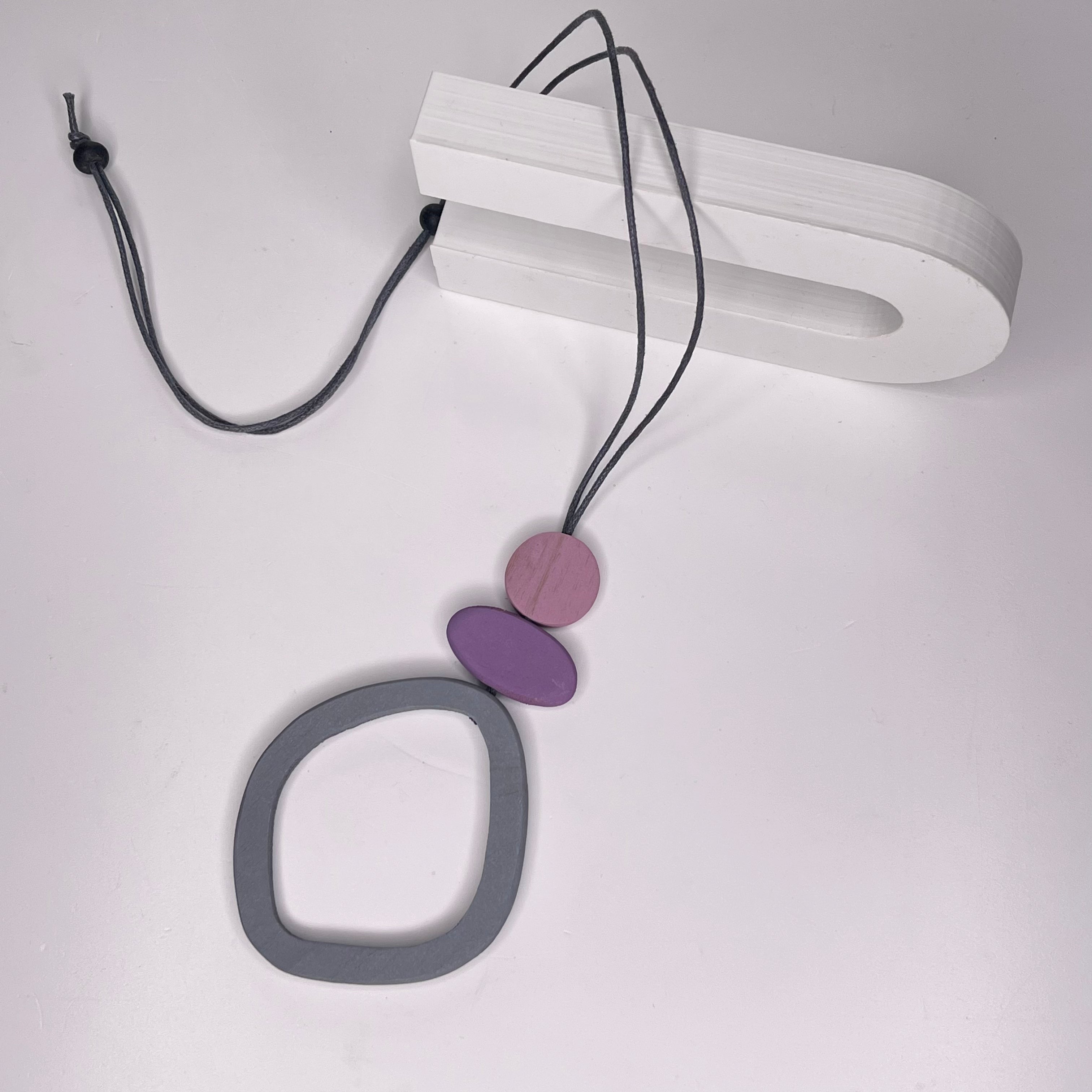 Organic wood necklace, with pink, purple and grey pendant, completely adjustable fastening