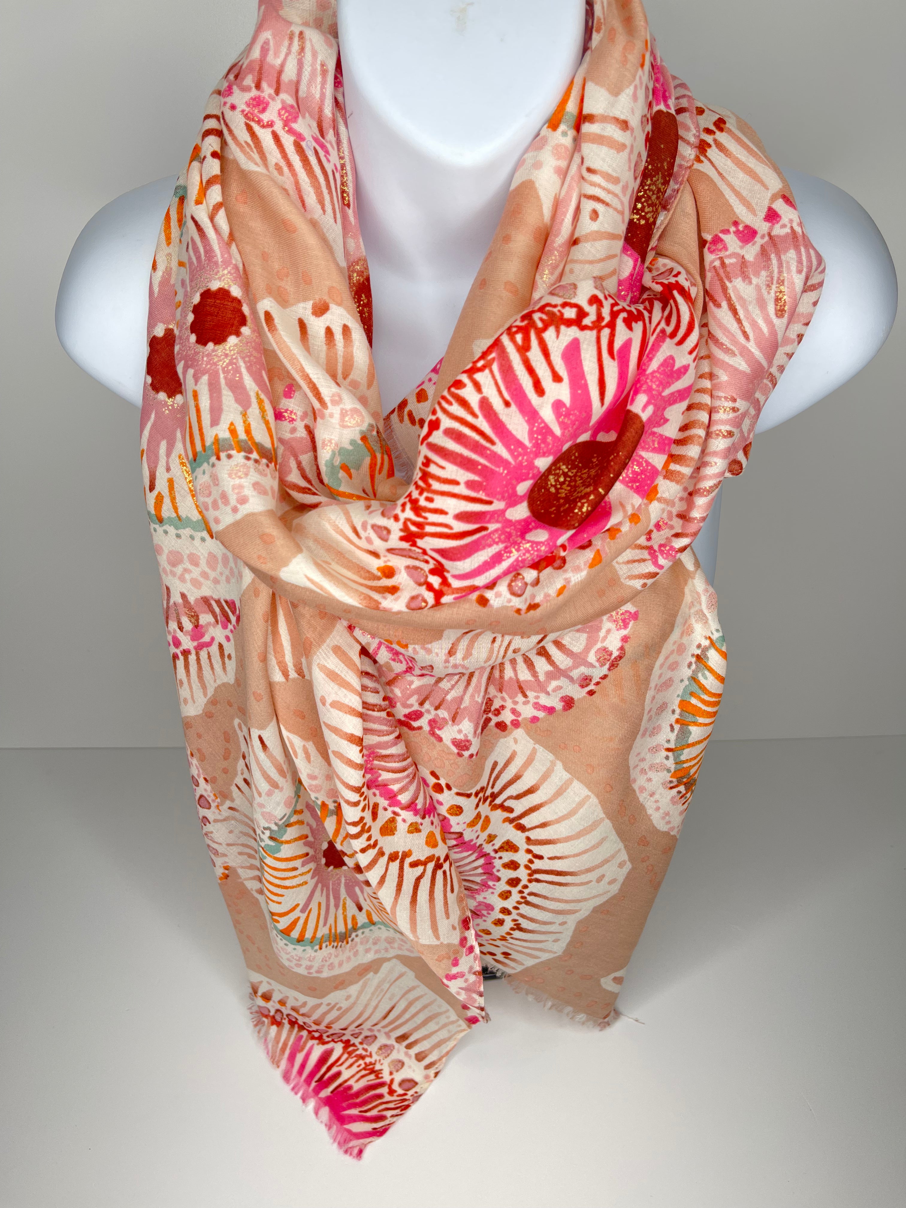 Circular print scarf in shades of orange, beige, pink and white